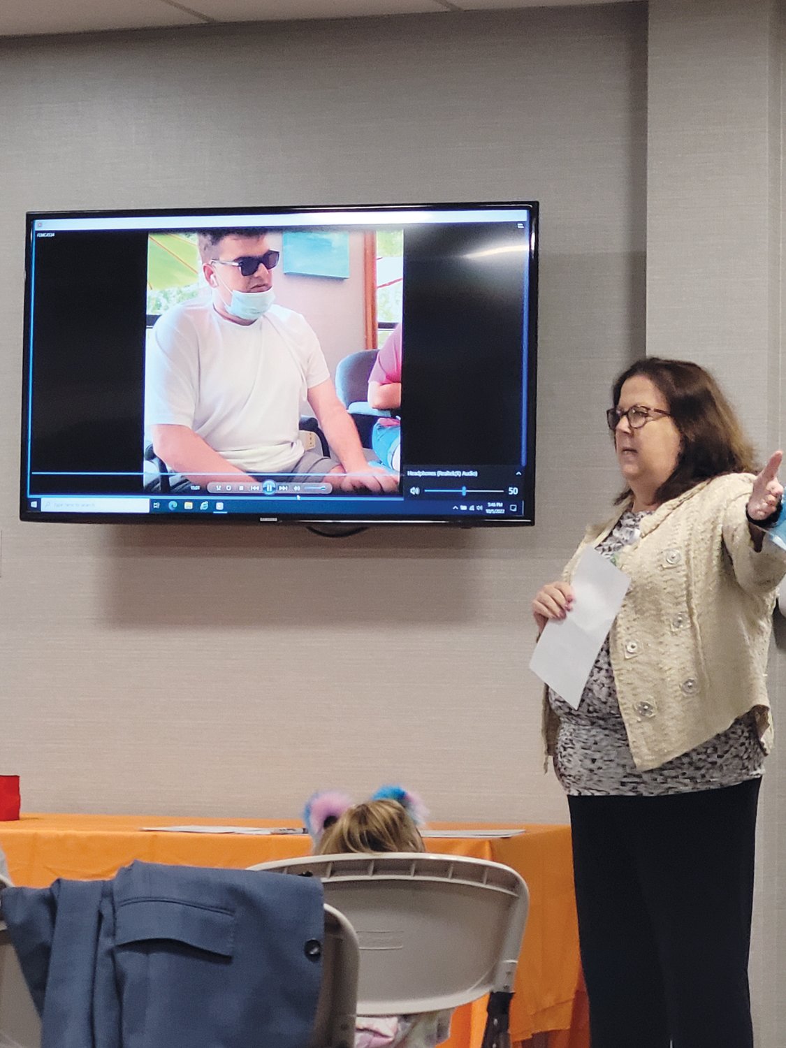 LEADING THE CHARGE: The Autism Project (TAP) Executive Director Joanne G. Quinn spoke to the audience gathered in the organization’s Atwood Avenue headquarters last Wednesday, following a short film depicting the Unity Community’s many successes and programs.